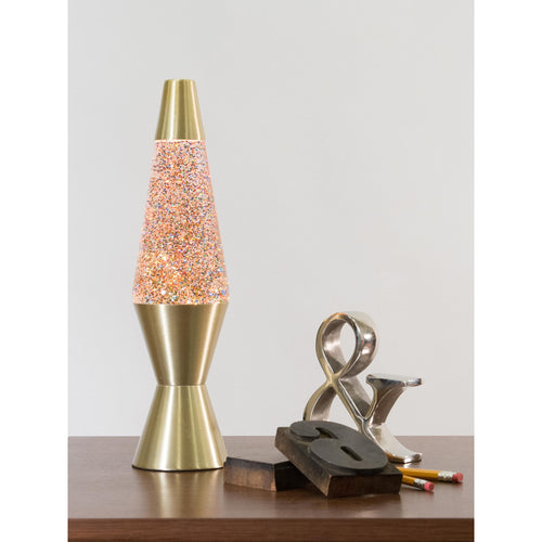 14.5” LAVA® Lamp Rainbow Glitter – Clear/Gold on a table with knick knacks