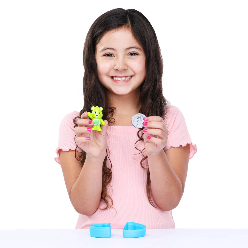 Care Bears surprise figure being held by girl