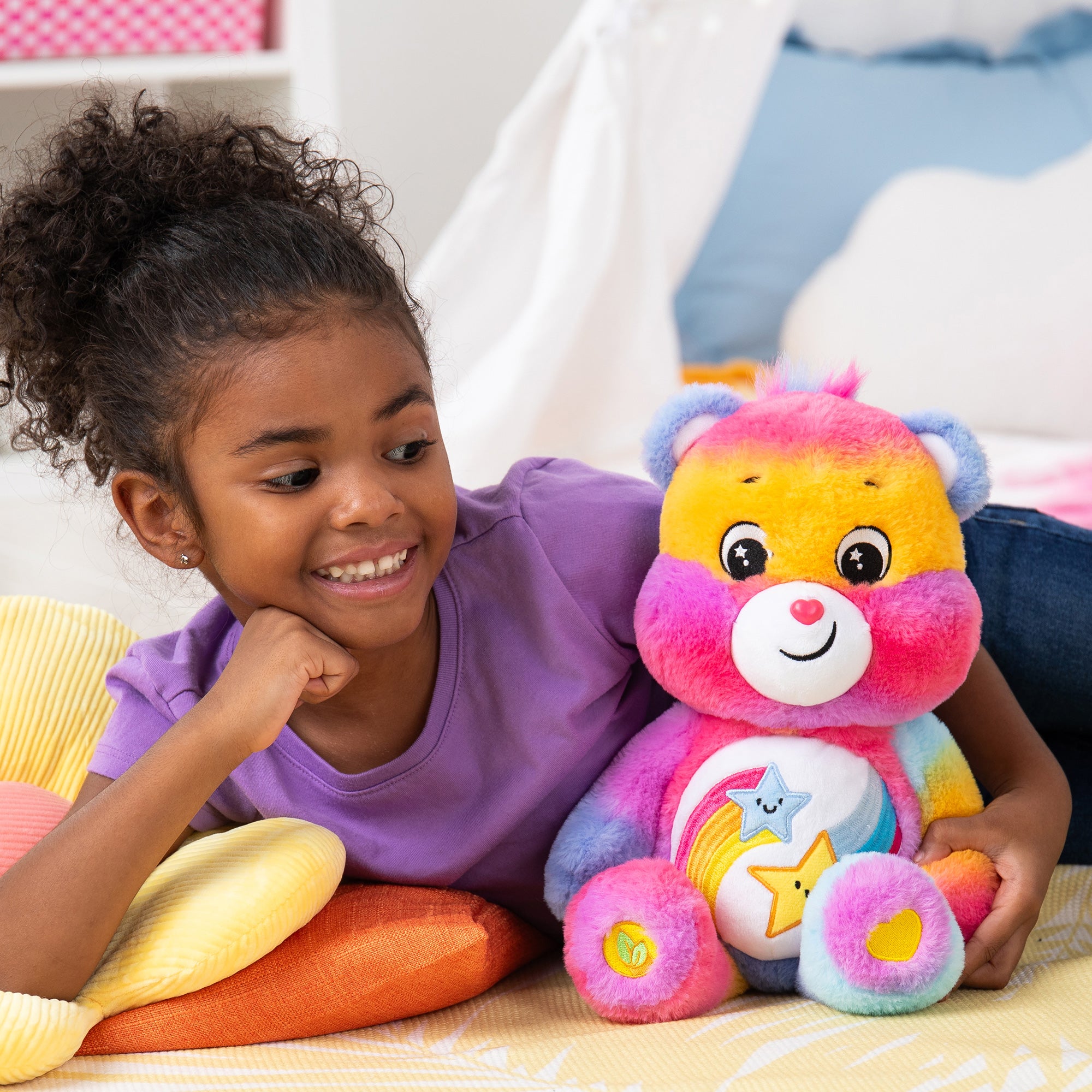 Care Bears Medium Plush - Lifestyle shot of girl cuddling with bear
