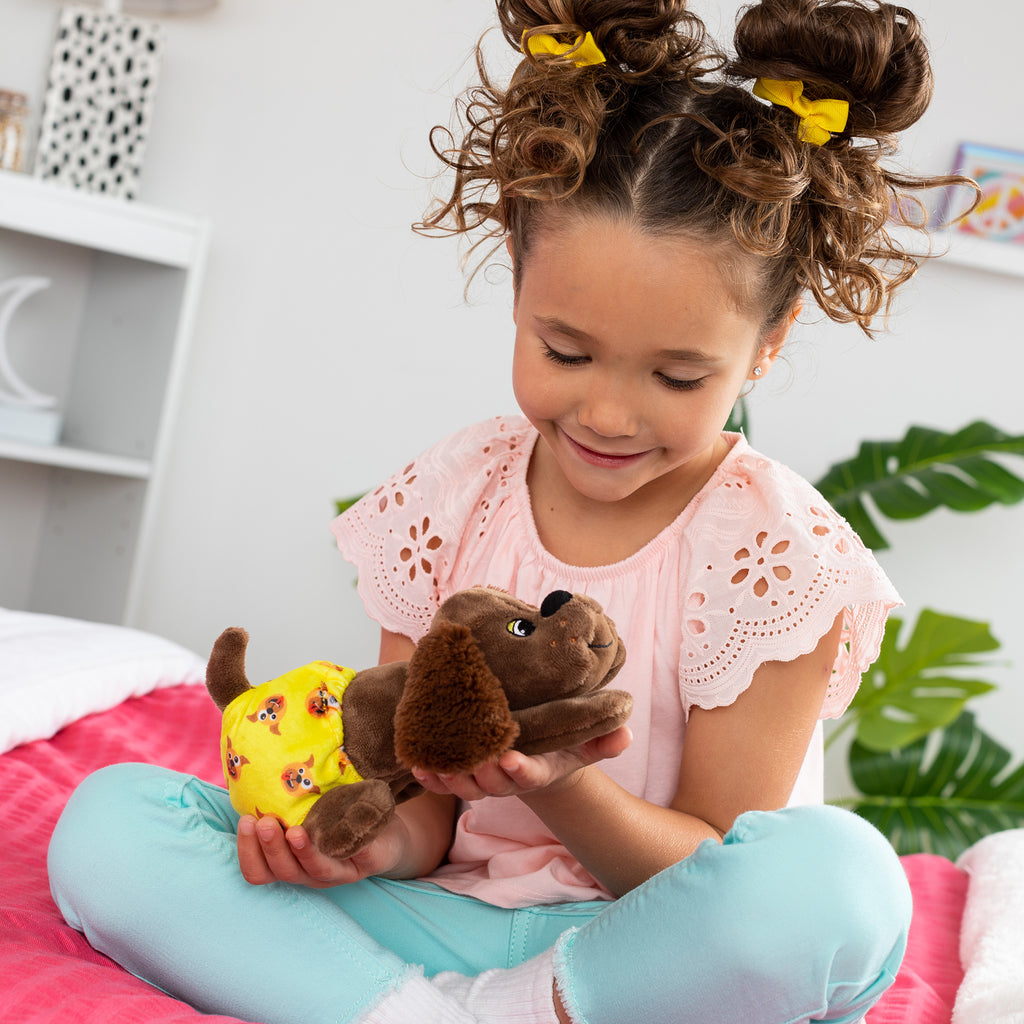 Pound Puppies Newborns - Lifestyle shot of girl holding Zany