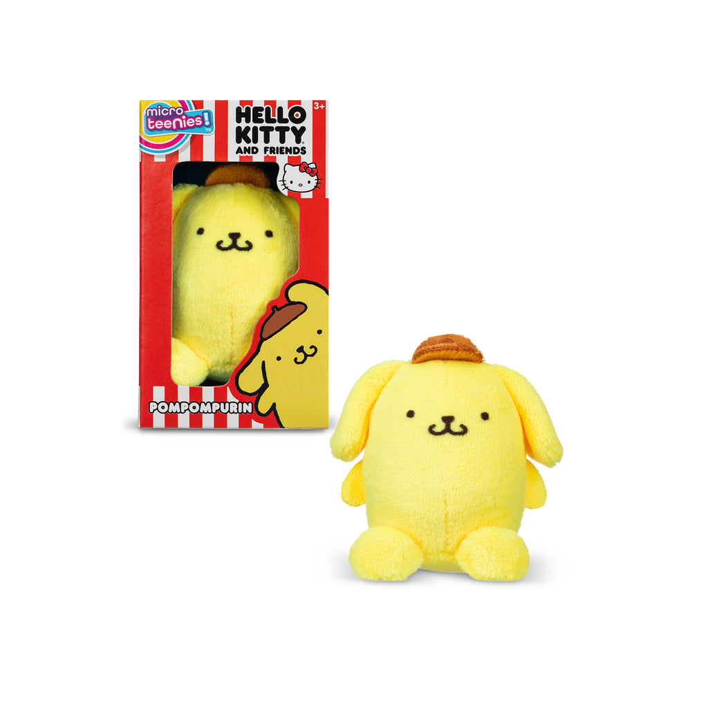 A plush toy of the Sanrio character Pompompurin, which is a yellow dog wearing a brown beret, is pictured outside and within its box. The box, featuring red and white stripes and the "Micro Teenies Hello Kitty and Friends" branding, displays the toy through a clear window.