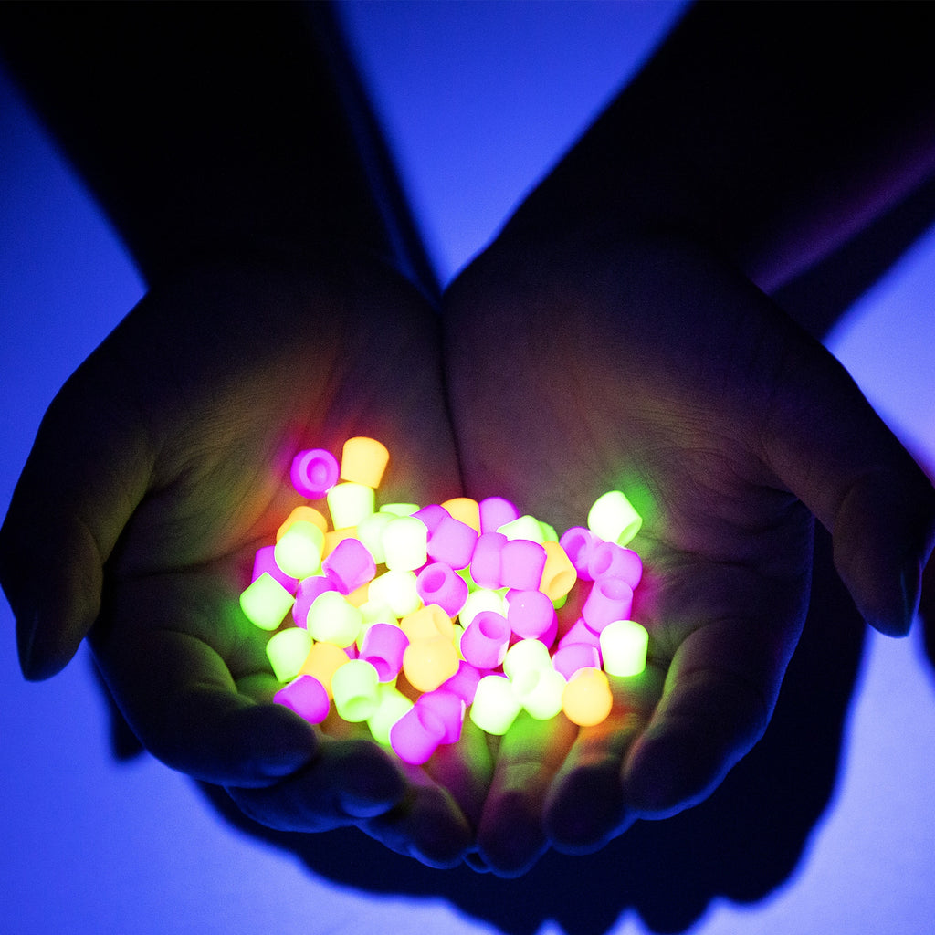 Brite Ball caps in hands glowing